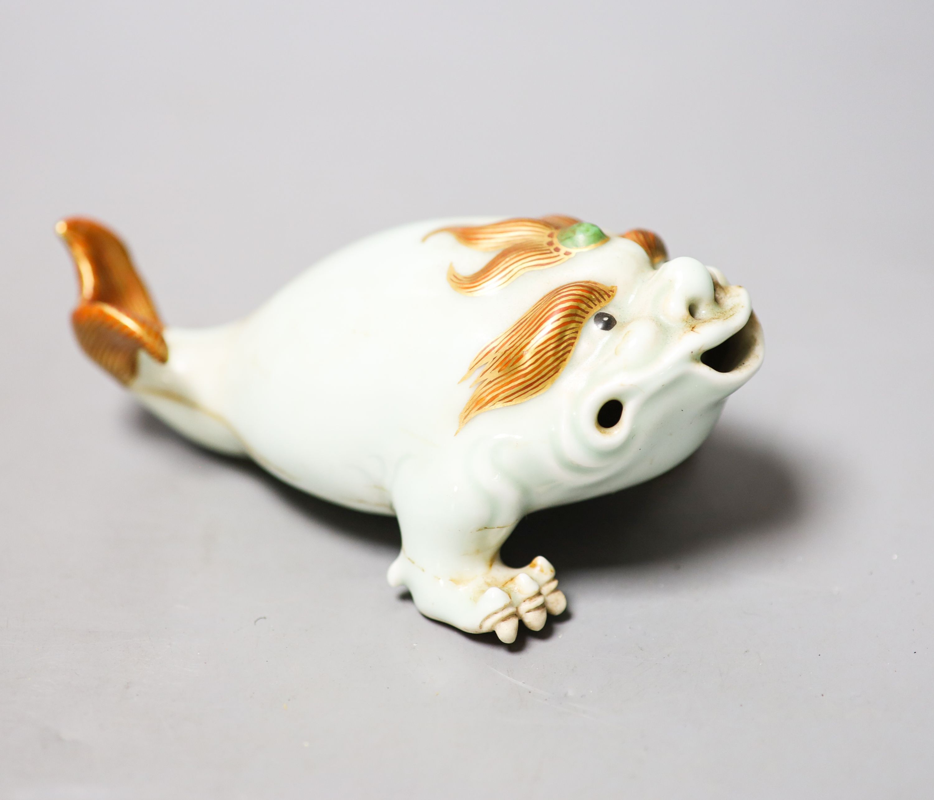 A Chinese celadon glazed model of a mythical creature, 13.5cm